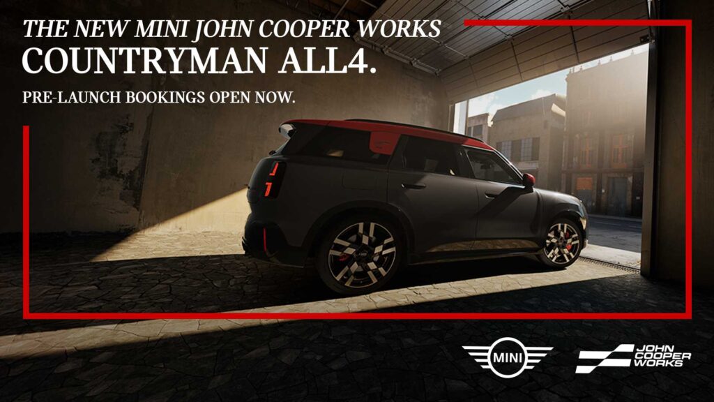 Mini JCW Countryman ALL4 2025 side view with JCW alloy wheels and sporty accents