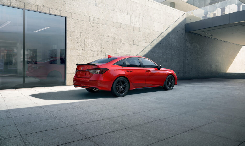 Rear side view of Honda Civic 2025 with C-shaped LED taillights and aerodynamic design