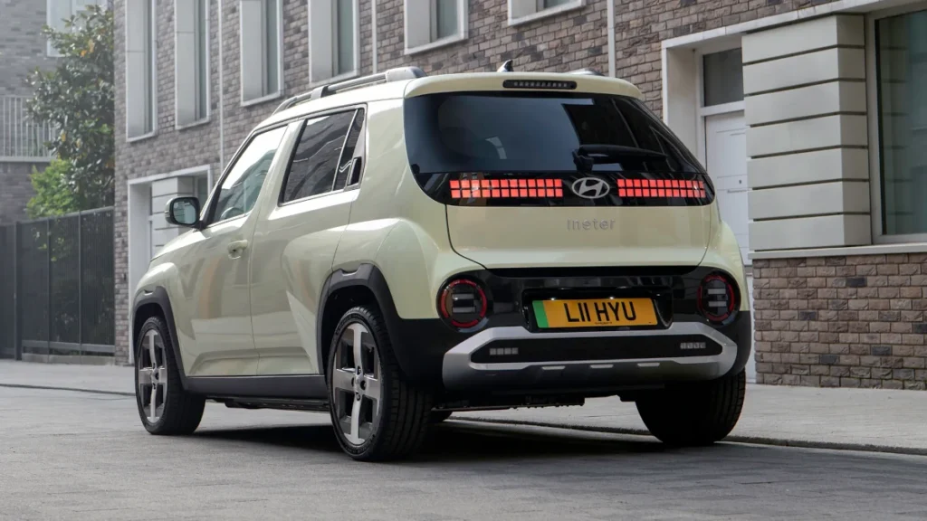 Hyundai Inster Compact EV SUV rear side profile with flowing lines and 17-inch alloy wheels