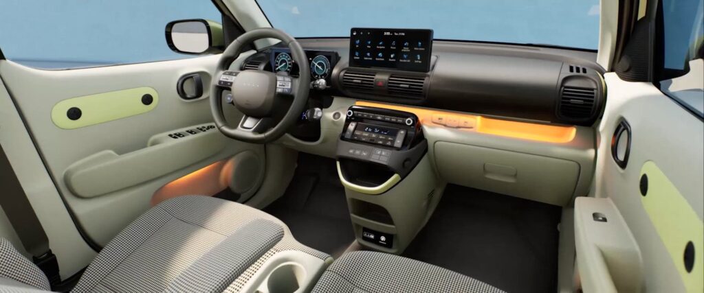 Hyundai Inster interior with 10.25-inch dual touchscreen and ambient lighting