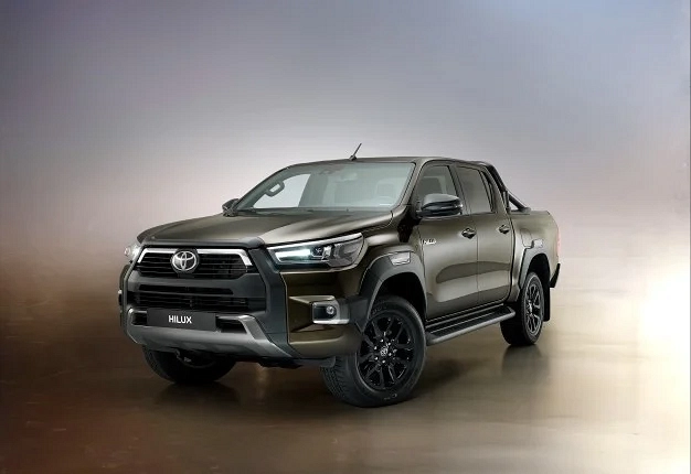 Interior shot of Toyota Hilux Travel showing leatherette seats and 8-inch touchscreen infotainment system