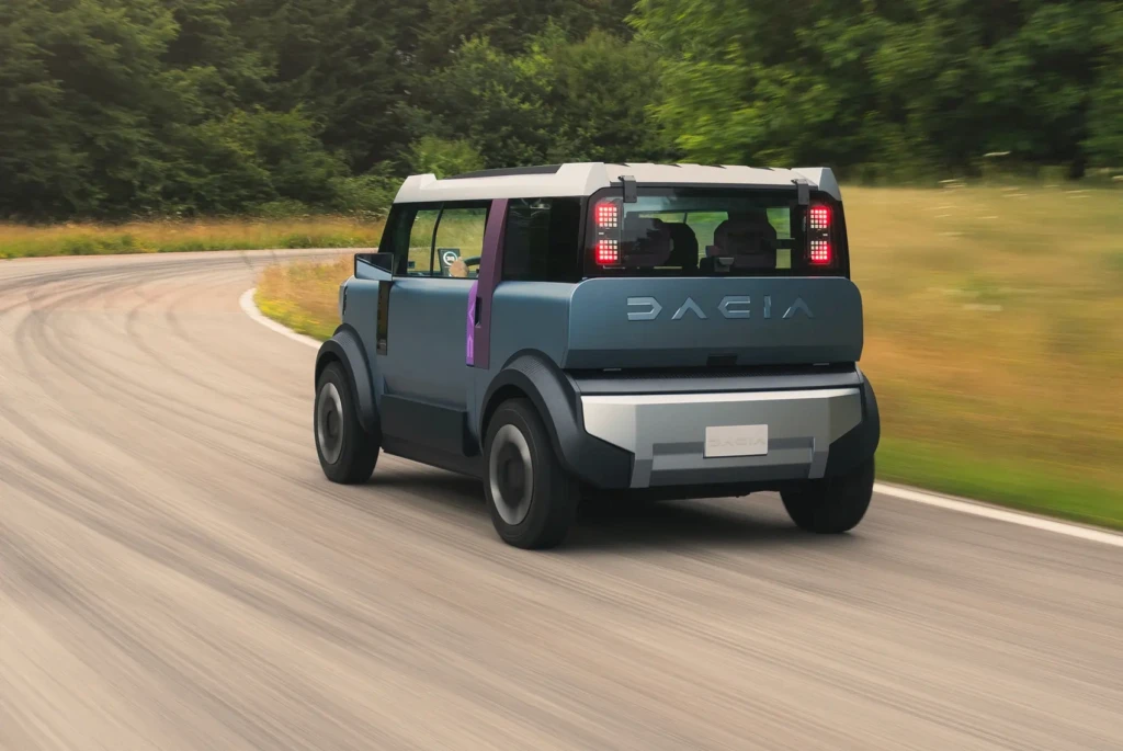 Rear view of Renault Dacia 2025 showing slim LED tail lamps, matte skid plate, and sleek Dacia lettering