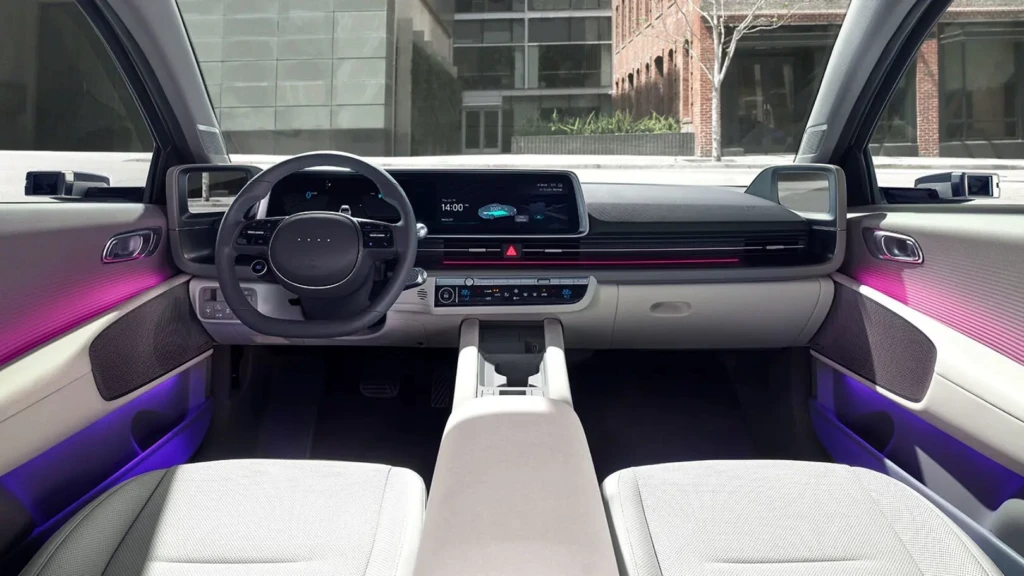Hyundai Ioniq 6 2025 interior showing minimalist dash, dual 12-inch digital screens, ambient lighting, and eco-leather seats