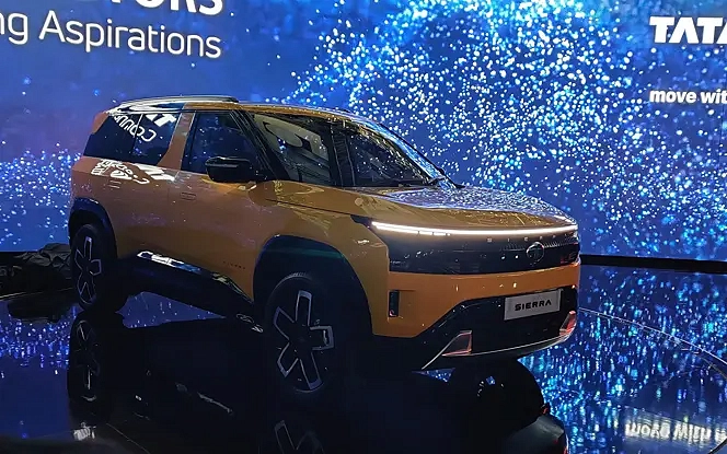 Tata Sierra 2025 front view with signature split LED DRLs, gloss black grille, and chunky front bumper